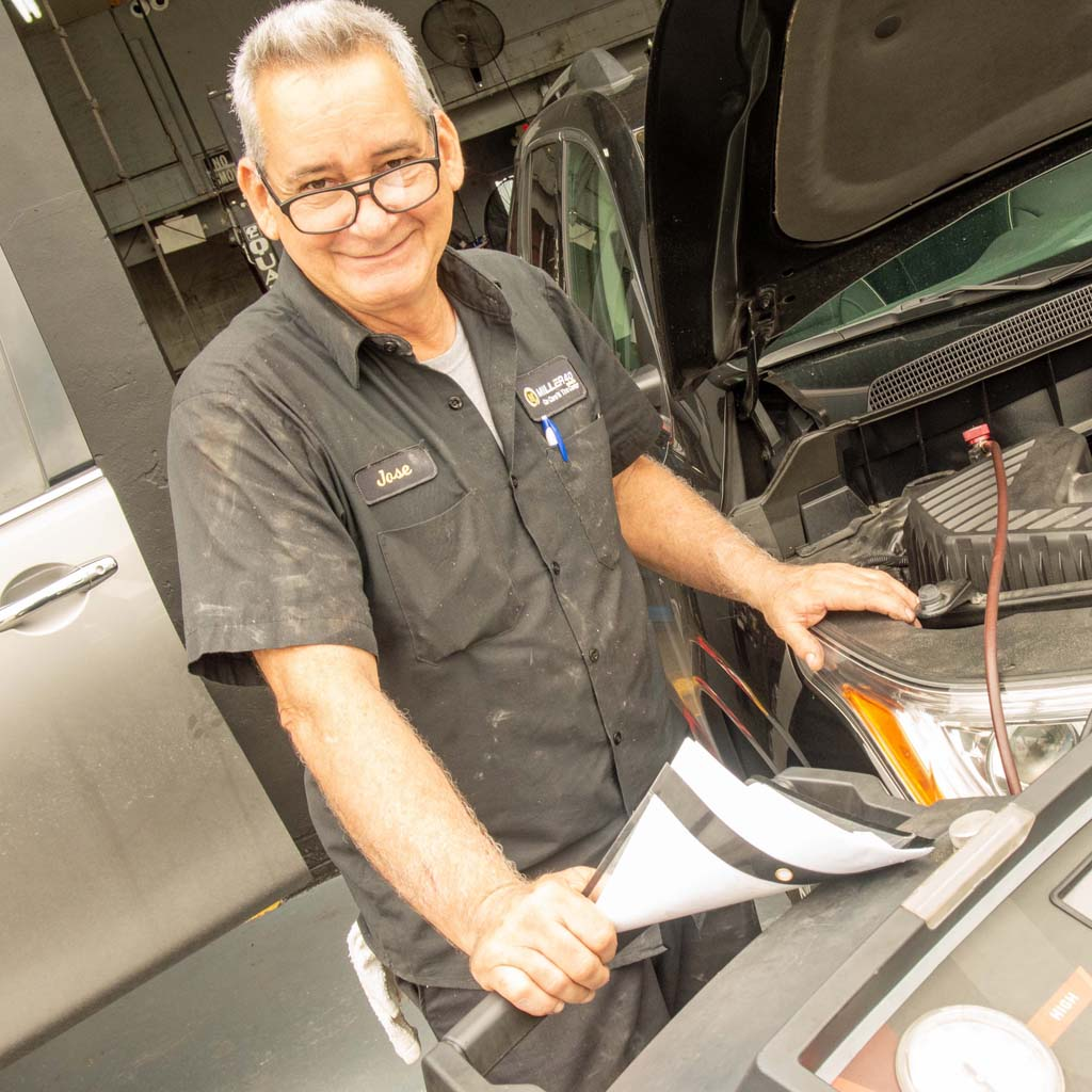 Mechanic working inside a car